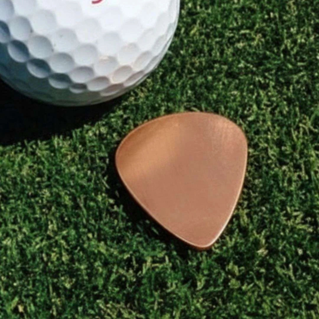 Guitar Pick Ball Marker on the green — custom branded by Motive