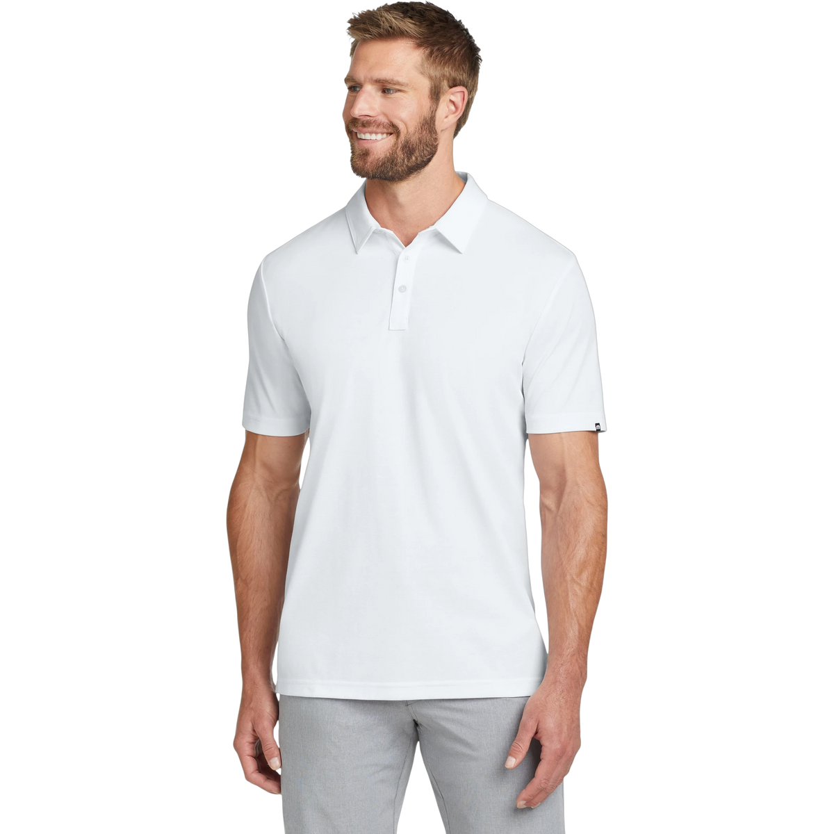 TravisMathew Oceanside Solid Polo in White — custom branded by Motive